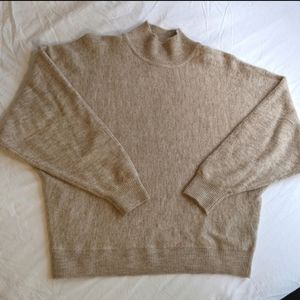 Soft mock neck nude sweater